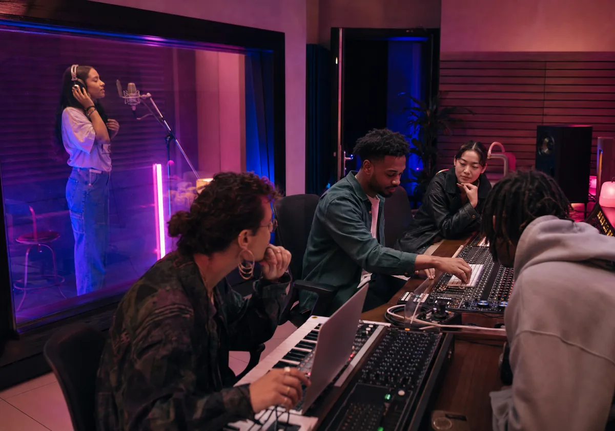 Team recording session in a studio control room
